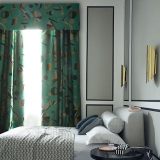 bedroom with curtains and cushions