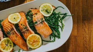 Dish containing roasted salmon and greens