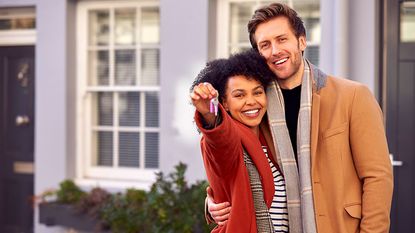 Couple with house keys