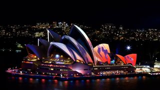 Sydney Opera House lit up during a light show