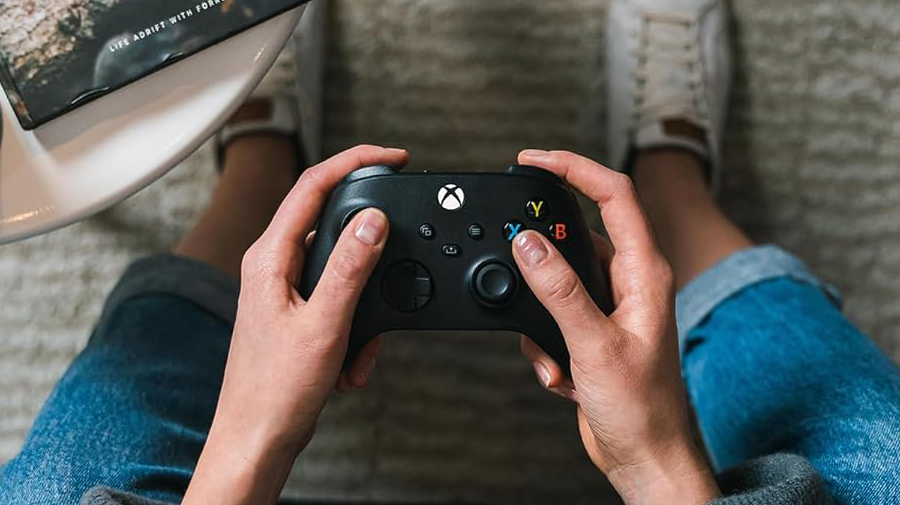 Xbox Wireless Controller held by gamer