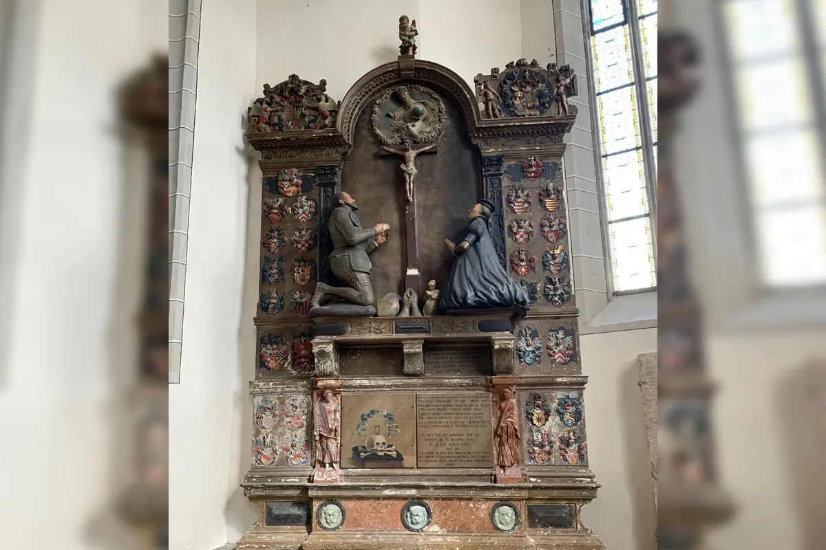 The coins were discovered in the leg of the kneeling count statue at St. Andrew's Church in Eisleben, Germany. Image credit: U. Dräger, Halle