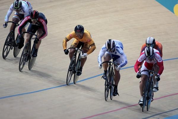Riders sprint to the finish line in the men's keirin final.