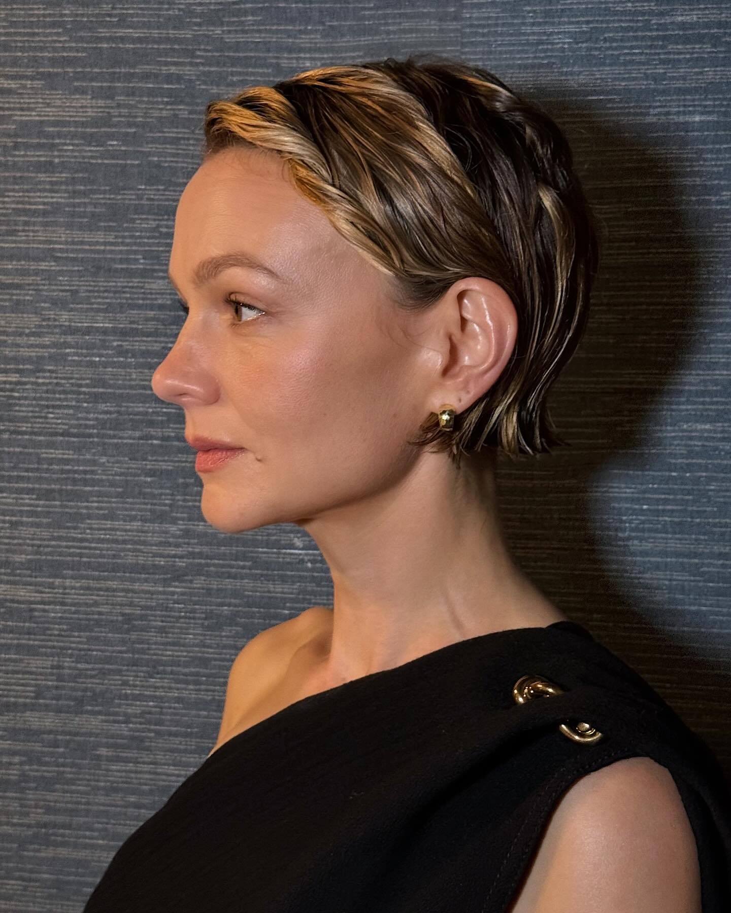 Carey Mulligan with a slicked-back tucked pixie hairstyle