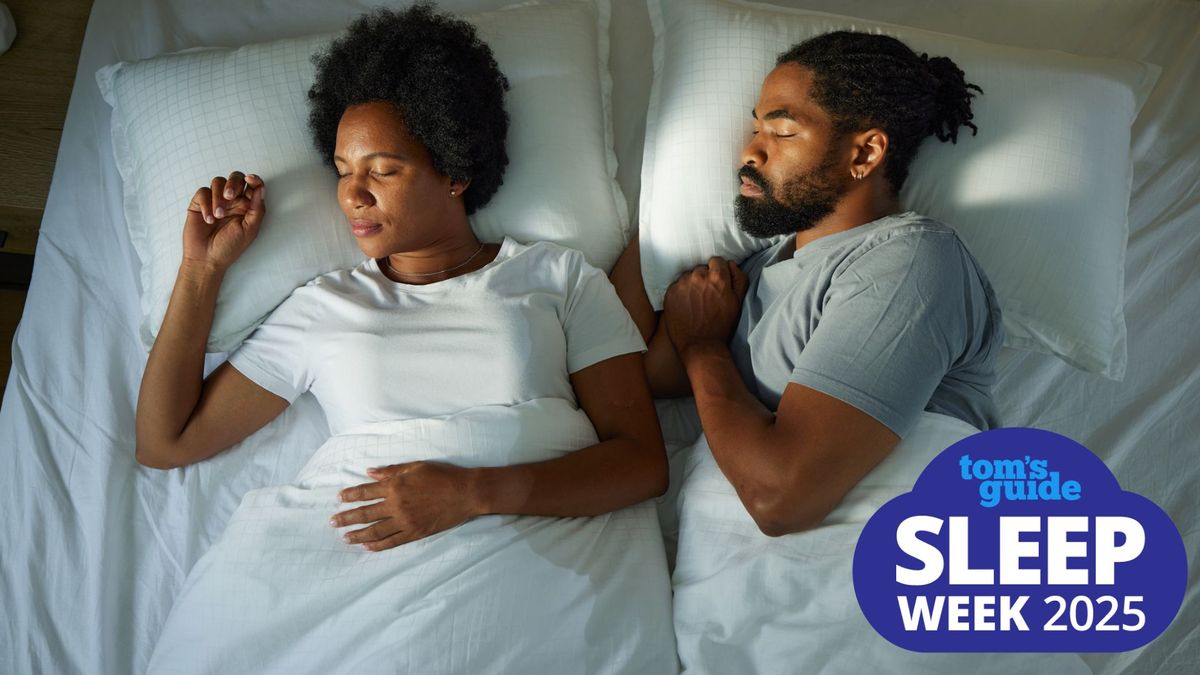 A couple sleeping next to each other, the woman on her back and the man on his side, with a Tom&#039;s Guide Sleep Week 2025 logo in the bottom right corner