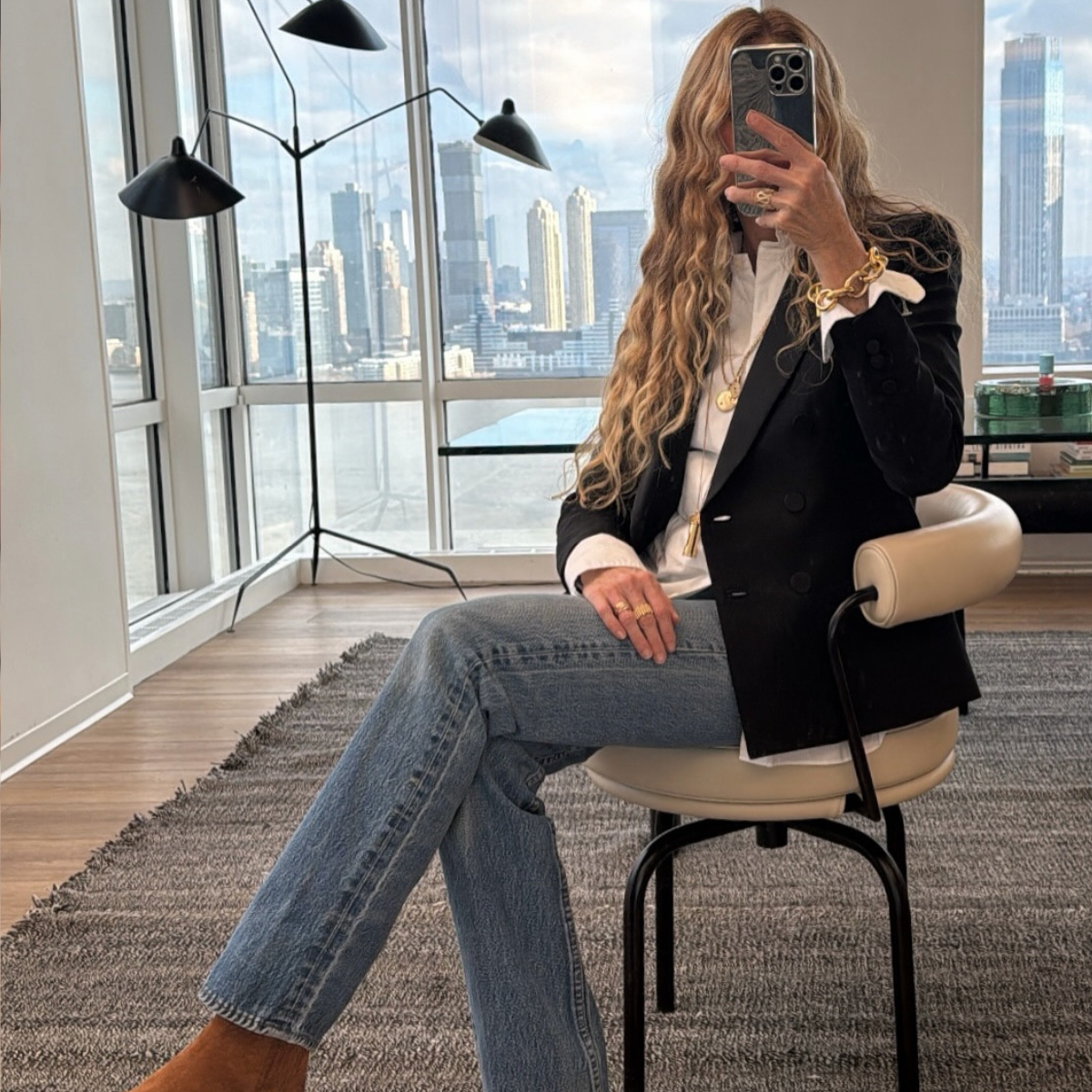 @olympiamarie wears blazer and jeans