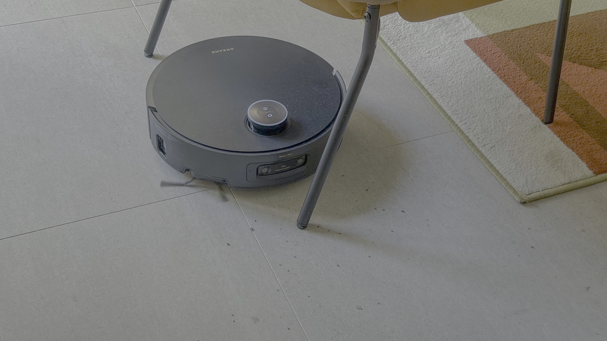 Dreame Aqua10 Ultra robot vacuuming under a chair