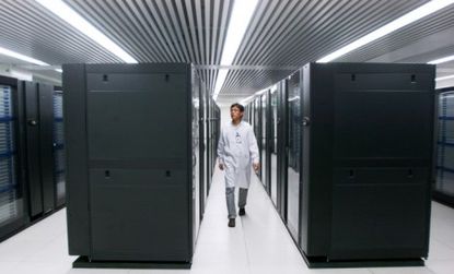 A Chinese engineer walks between the racks of the Tianhe-1A supercomputer, which is allegedly 1.4 times faster than the now second-fastest computer.