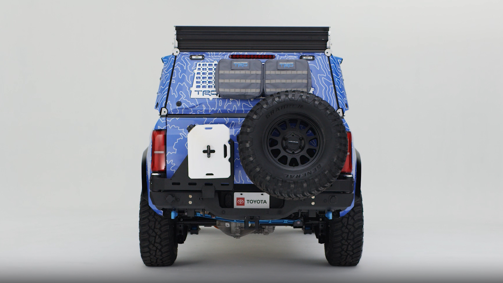 A Tacoma H2-Overlander truck in a studio