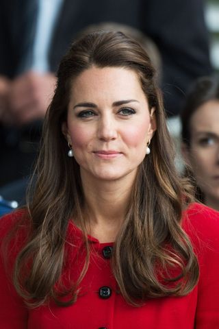 Kate Middleton headshot with a half up half down hairstyle