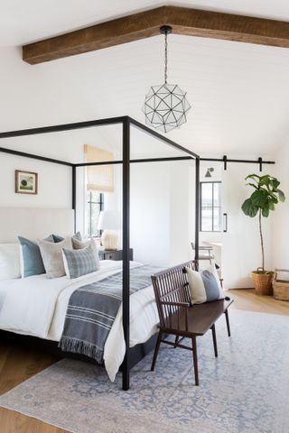 farmhouse bedroom with four poster bed