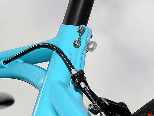 Astana team mechanics fashioned this clever mount for race numbers. The mount likely also prevents the somewhat touchy clamp arrangement from being overtightened.
