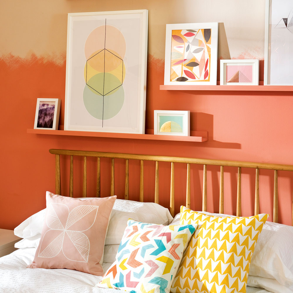 bedroom with two tone paint effect and picture rail above wooden bed