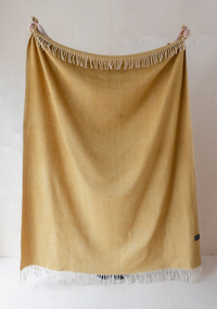 Recycled Wool Blanket in Mustard Herringbone for £60.00, at The Tartan Blanket Co.