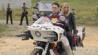 Peacemaker and Harcourt on the Peace-Cycle surrounded by Earth-X cops