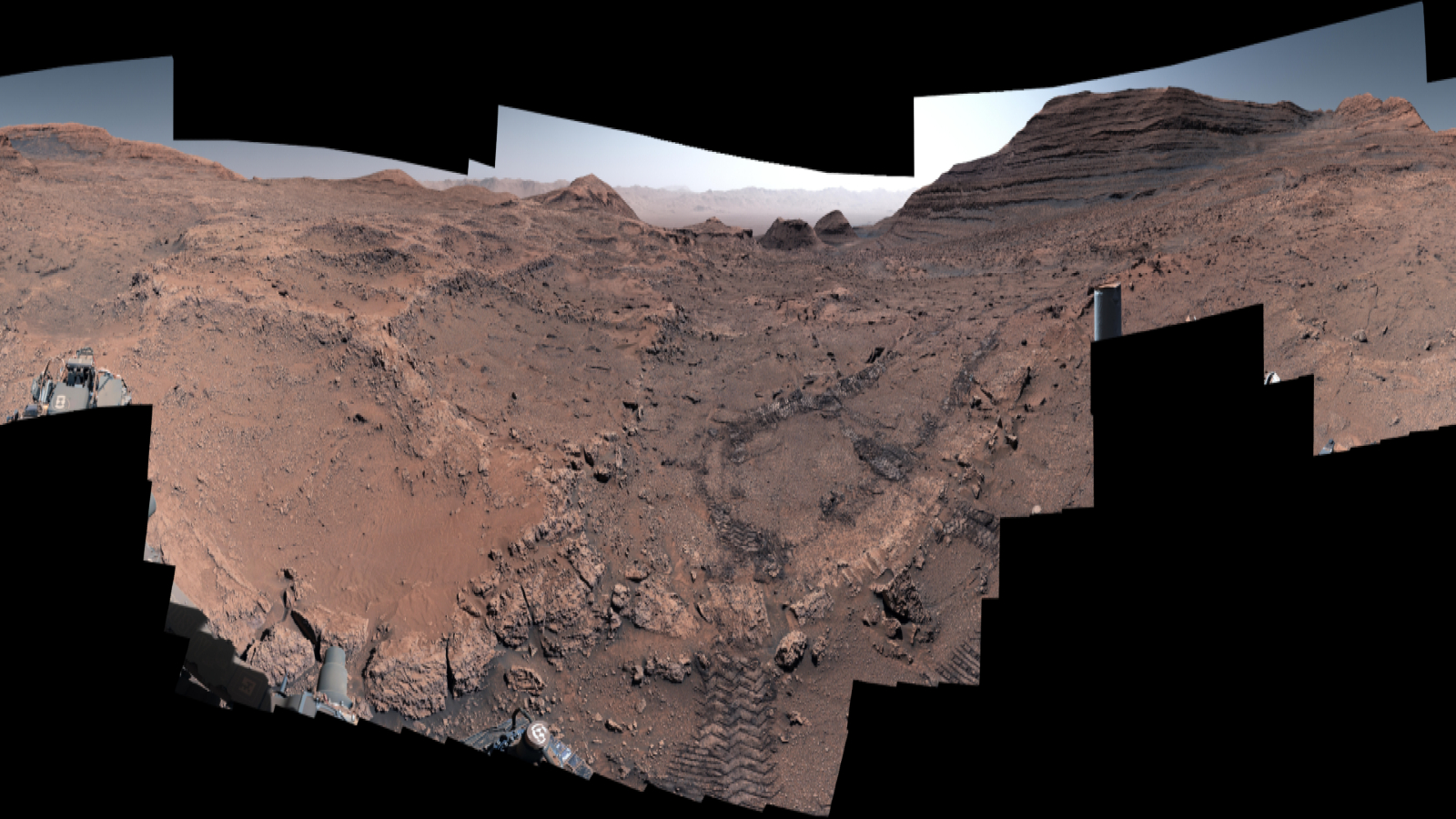 A series of red rocks over a black background