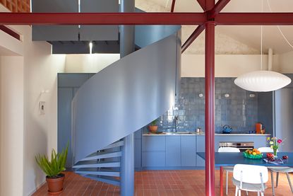 blue spiral staircase in a modern kitchen