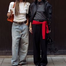 two women wearing sweaters