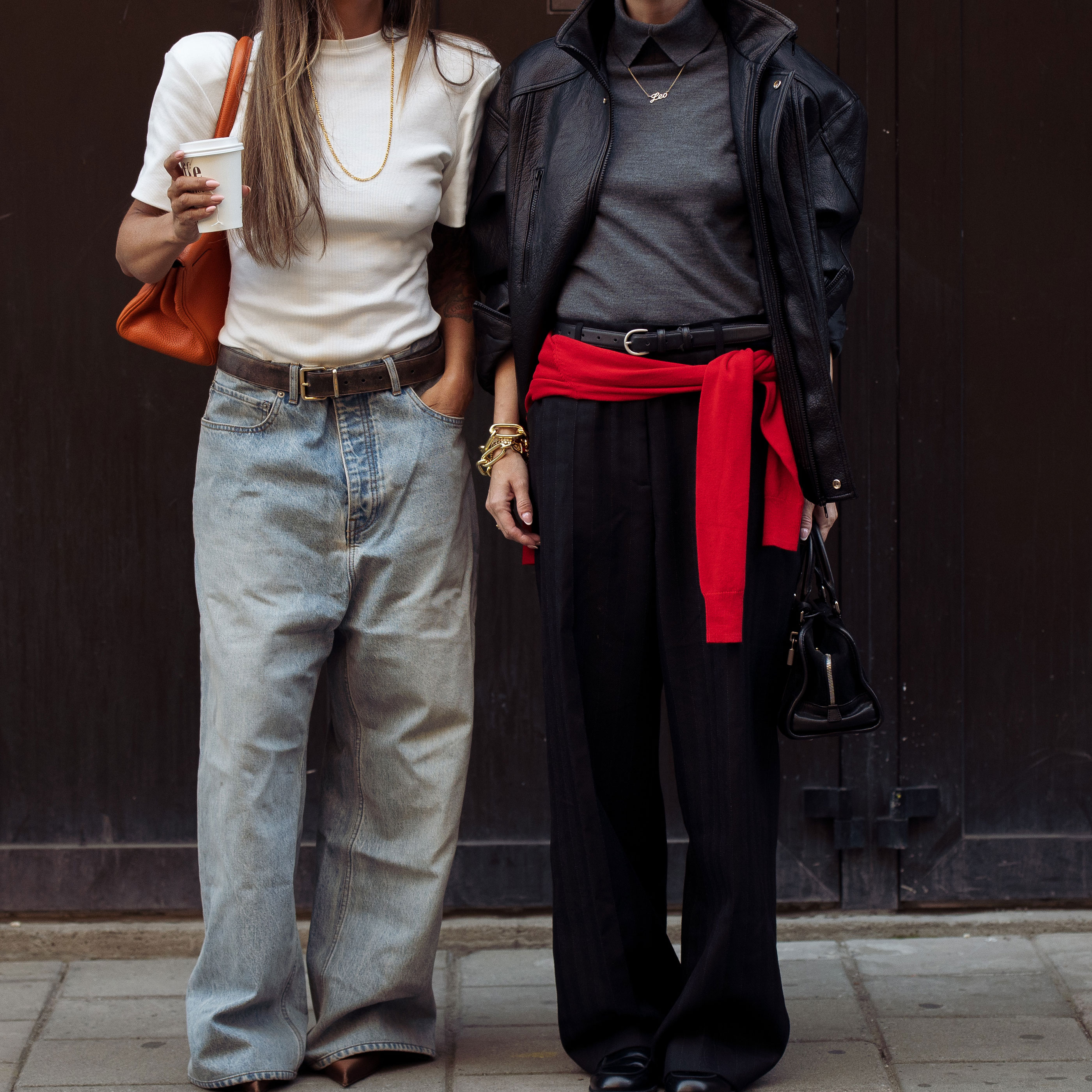 two women wearing sweaters