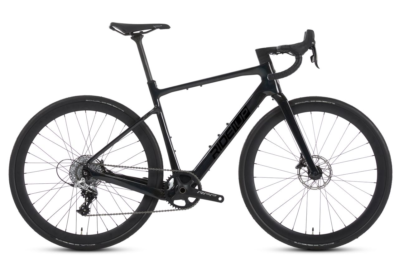 A glossy black road bike with hydraulic disc brakes, shown straight on from the drivetrain side.