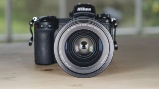 Viltrox AF 35mm F1.2 LAB Z lens for Nikon, attached to a Nikon Z6 II, on a wooden table