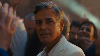 Jay (George Clooney) is surrounded by a crowd in Jay Kelly.