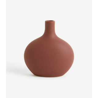 brown stoneware vase with a round shape
