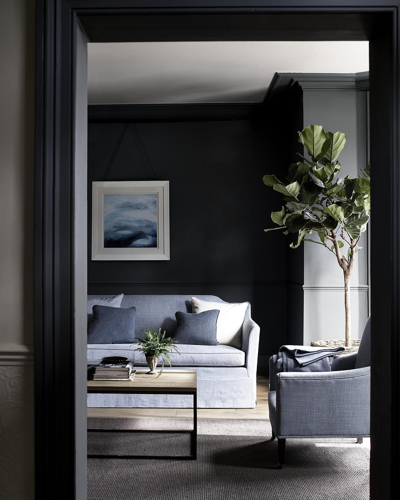 A grey living room idea by Neptune with grey-blue upholstered sofas, framed wall art and large houseplant