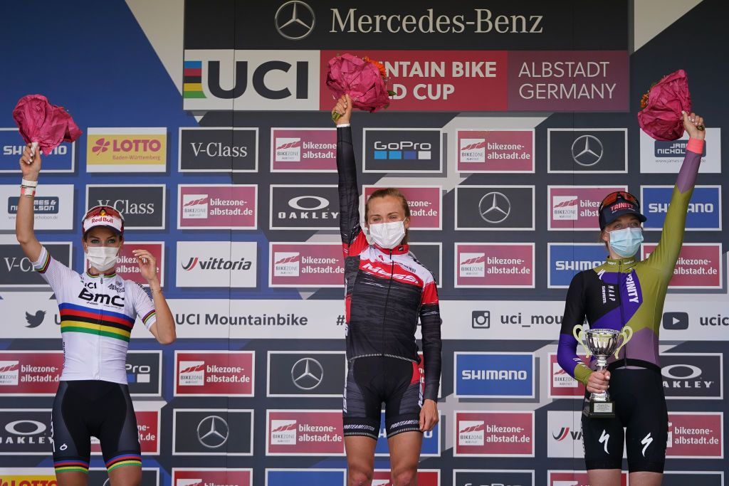 ALBSTADT GERMANY MAY 09 LR Pauline Ferrand Prevot of France Loana Lecomte of France and Haley Batten of United States of America celebrate on podium after CrossCountry Olympic Women Elite race during UCI Mountain Bike World Cup on May 09 2021 in Albstadt Germany Photo by Christian KasparBartkeGetty Images