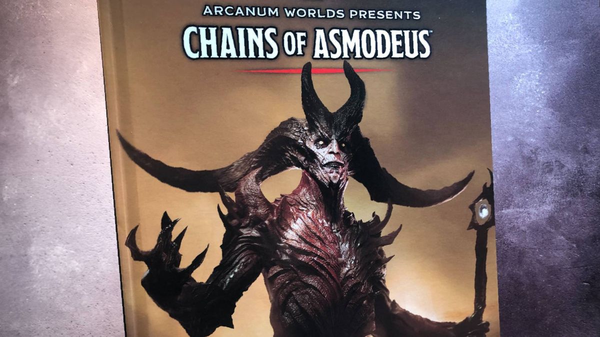 Cover of the hardback Chains of Asmodeus book against a gray background