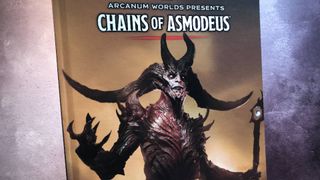 Cover of the hardback Chains of Asmodeus book against a gray background