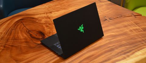 A Razer Blade 15 (2022) on a wooden table