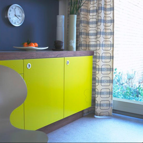 Blue wall with lemon cabinet and curtains on window