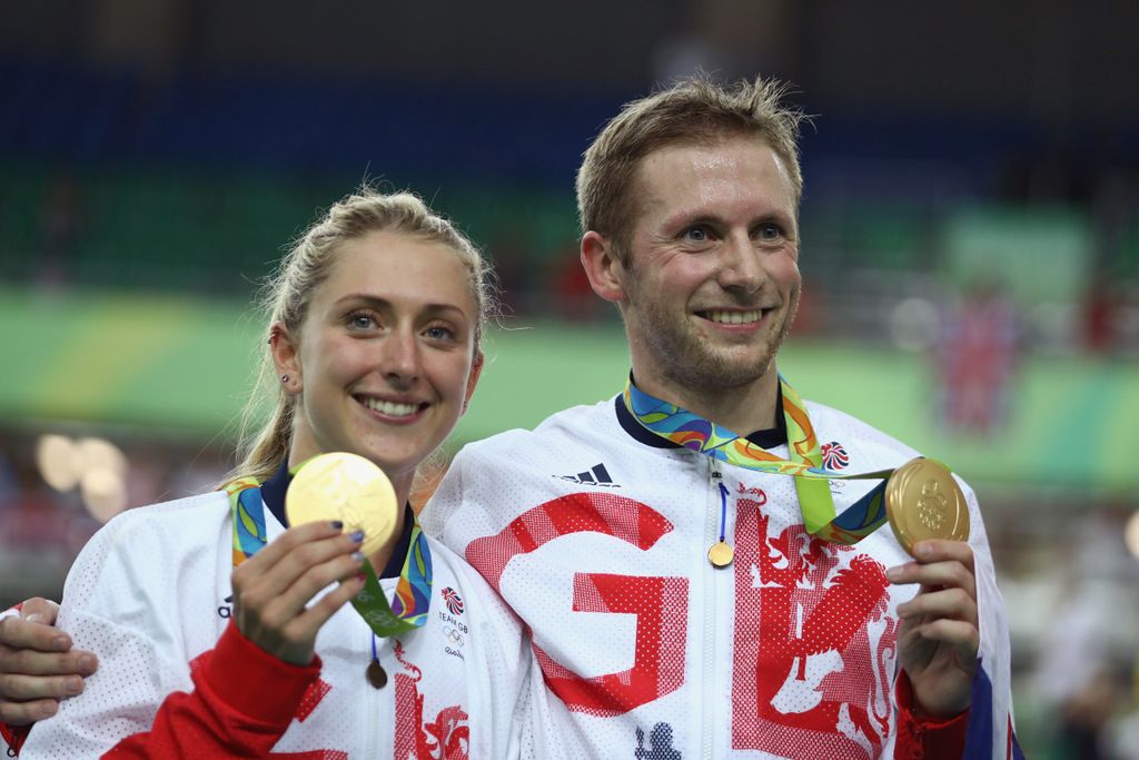Laura Trott and Jason Kenny show off their gold medals