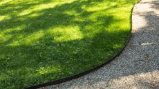 Curved lawn edging next to neat gravel path