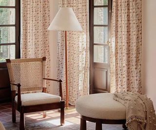 Patterned curtains against a patterned wall.