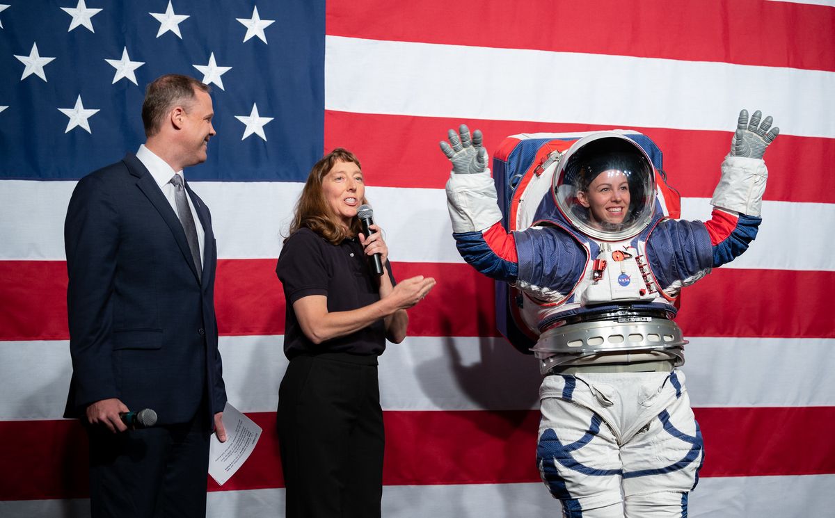 NASA Administrator Jim Bridenstine, left, and Amy Ross, a spacesuit engineer at NASA&rsquo;s Johnson Space Center, left, are seen with Kristine Davis, a spacesuit engineer at NASA&rsquo;s Johnson Space Center, wearing a ground prototype of NASA&rsquo;s new Exploration Extravehicular Mobility Unit (xEMU), during a demonstration of the suit, Tuesday, Oct. 15, 2019 at NASA Headquarters in Washington.