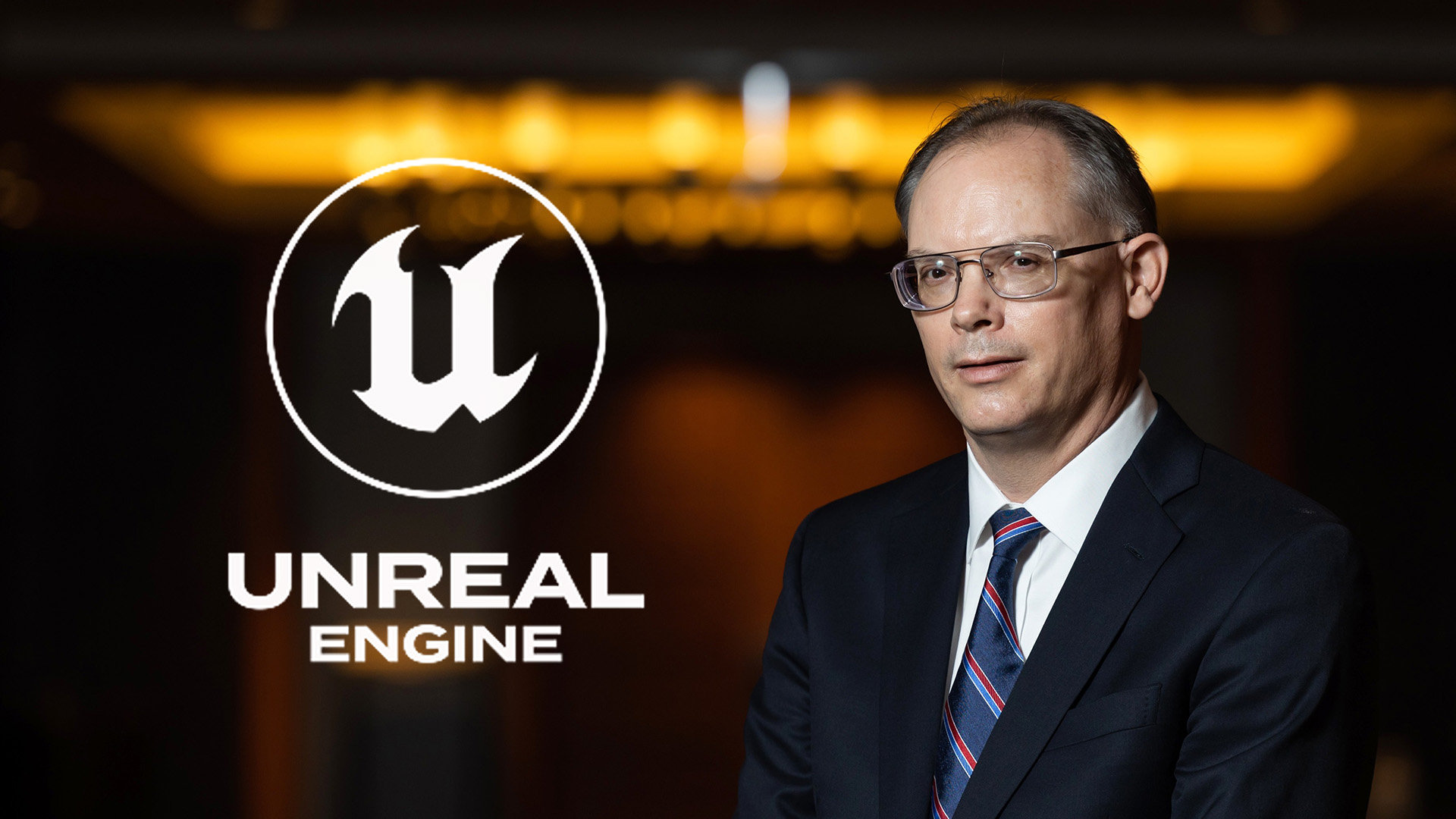 Epic Games CEO Tim Sweeney with Unreal Engine logo