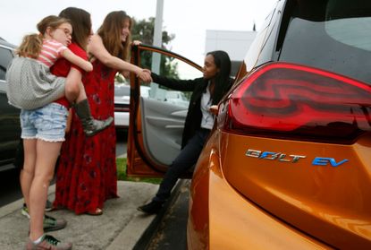 Woman test-drives Chevy electric vehicle
