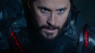 a bearded man in a glowing red suit at night