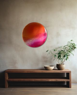 A living room with a large colorful resin mirror wall art piece