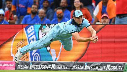 Chris Woakes takes a diving catch to dismiss Rishabh Pant during England's victory at the Cricket World Cup