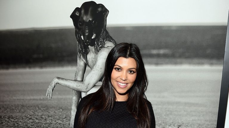 Kourtney Kardashian in Front of One of Her Photos