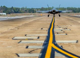 An F-35C Lightning II taxis down the flight line from the F-35 Strike Fighter Squadron at Eglin Air Force Base in Florida.