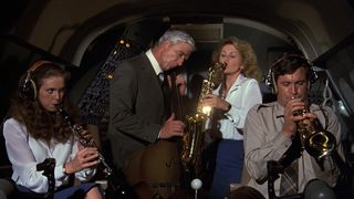 Julie Hagerty, Leslie Nielsen, Lorna Patterson, and Robert Hays playing jazz in the cockpit in Airplane!