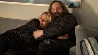 Becki Newton and Angus Sampson as Lorna and Cisco hugging in The Lincoln Lawyer season 2