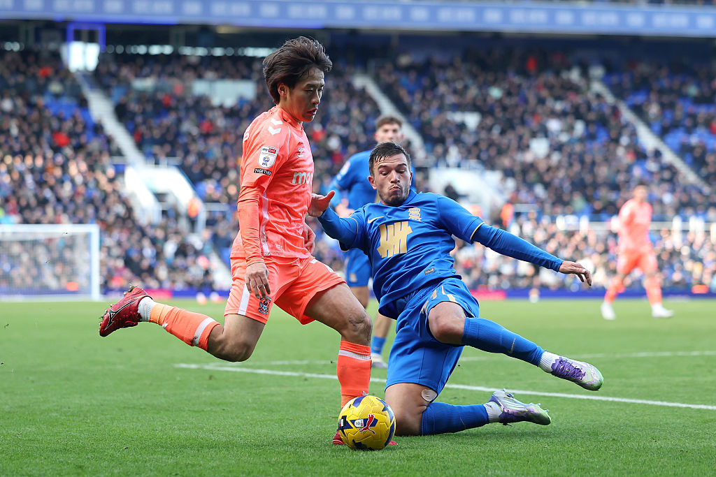 BIRMINGHAM, ENGLAND - JANUARY 04: Tatsuhiro Sakamoto of Coventry City is tackled by Kai Wagner of Birmingham City during the Sky Bet Championship match between Birmingham City and Coventry City at St Andrew&amp;rsquo;s at Knighthead Park on January 04, 2026 in Birmingham, England. (Photo by Matt McNulty/Getty Images)