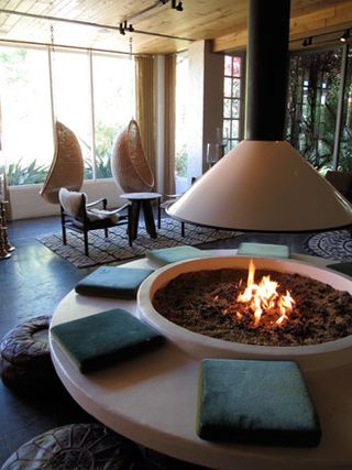 Interior design of room showing fire pit and circular sitting area
