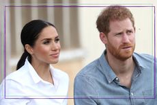 Meghan Markle UK citizenship test - Meghan Markle and Prince Harry sit together, looking serious as they visit a local farming family, the Woodleys, on October 17, 2018 in Dubbo, Australia. The Duke and Duchess of Sussex are on their official 16-day Autumn tour visiting cities in Australia, Fiji, Tonga and New Zealand 