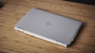 HP Spectre x360 (2021) closed on a wooden desk